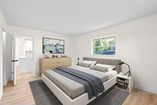 bedroom featuring light wood-type flooring