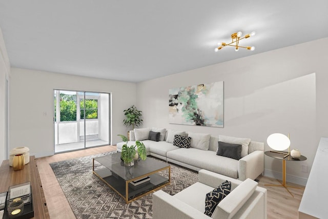 living room featuring hardwood / wood-style flooring and a notable chandelier