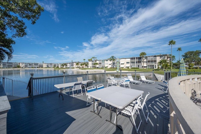 view of dock with a deck with water view