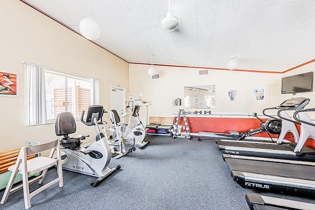 gym with ornamental molding