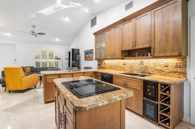 kitchen featuring ceiling fan, sink, backsplash, lofted ceiling, and black appliances