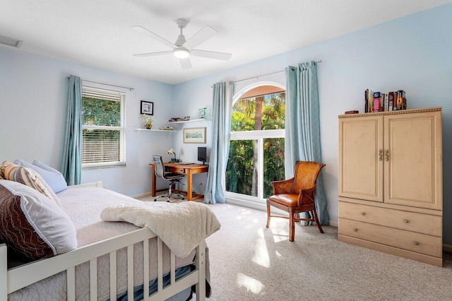 carpeted bedroom featuring ceiling fan