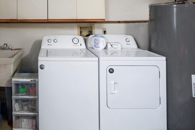 washroom featuring washer and dryer, sink, and water heater