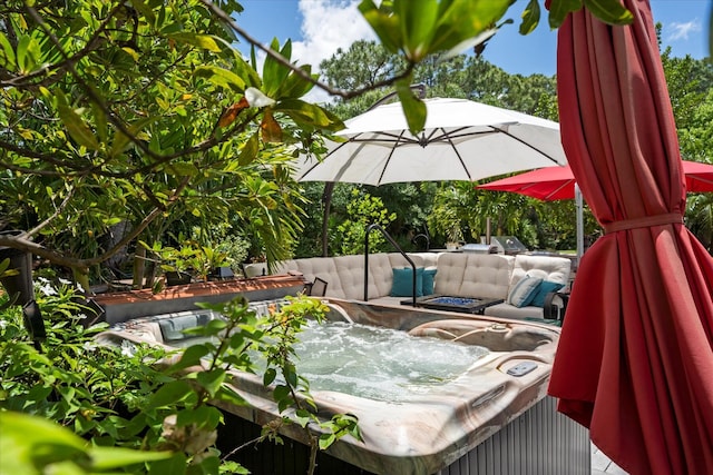 wooden deck with a fire pit and a hot tub