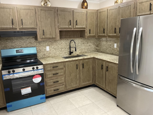 kitchen featuring backsplash, sink, light tile patterned floors, range hood, and stainless steel appliances