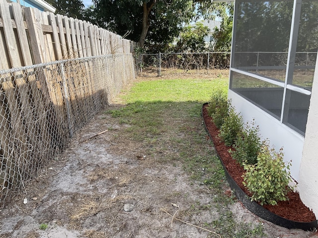 view of yard with a sunroom