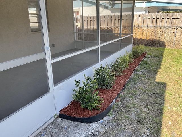 view of yard featuring a sunroom