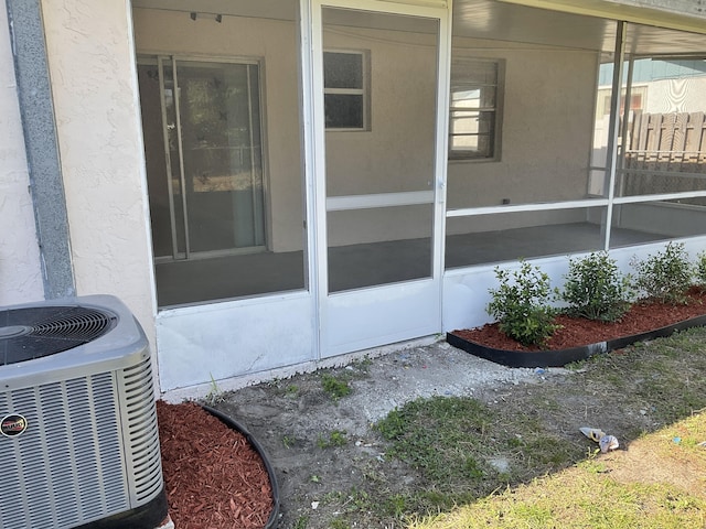 property entrance featuring central AC