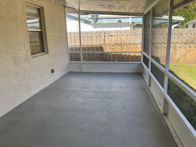 unfurnished sunroom with a wealth of natural light