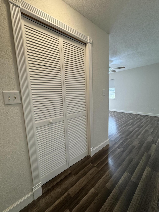 room details featuring a textured ceiling and hardwood / wood-style flooring