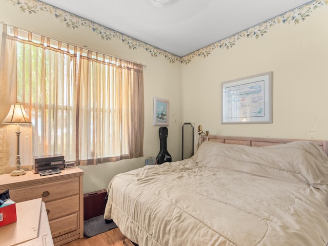 bedroom with light hardwood / wood-style flooring