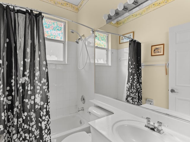 full bathroom with vanity, toilet, and shower / bath combo with shower curtain