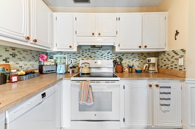 kitchen with backsplash, white cabinetry, white appliances, and a textured ceiling