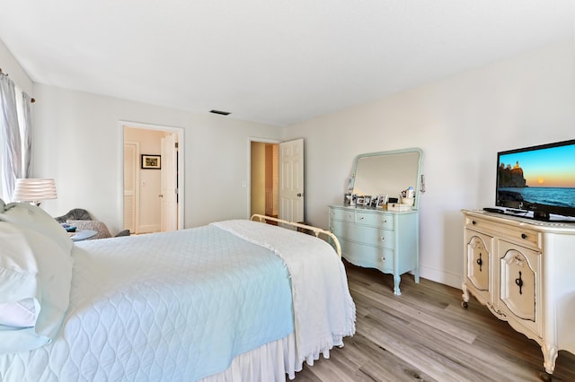 bedroom with light wood-type flooring