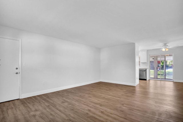 unfurnished living room featuring hardwood / wood-style floors and ceiling fan