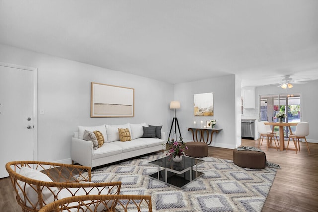 living room featuring hardwood / wood-style flooring and ceiling fan