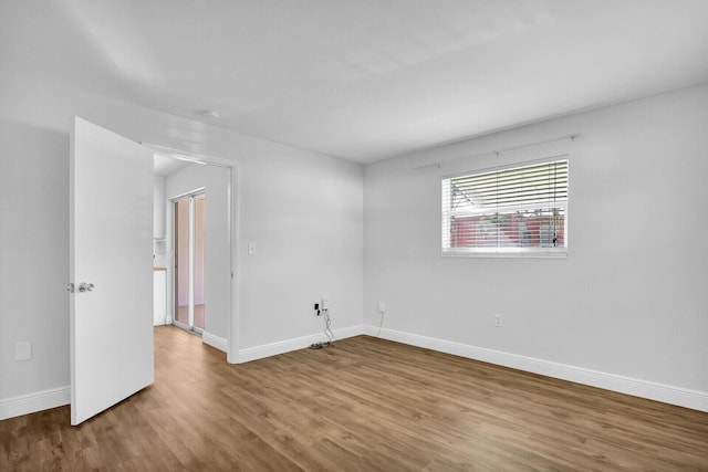 spare room featuring hardwood / wood-style floors