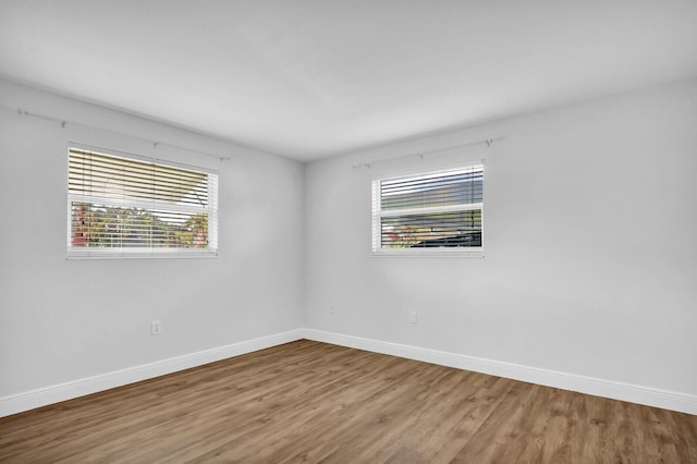 spare room featuring hardwood / wood-style floors