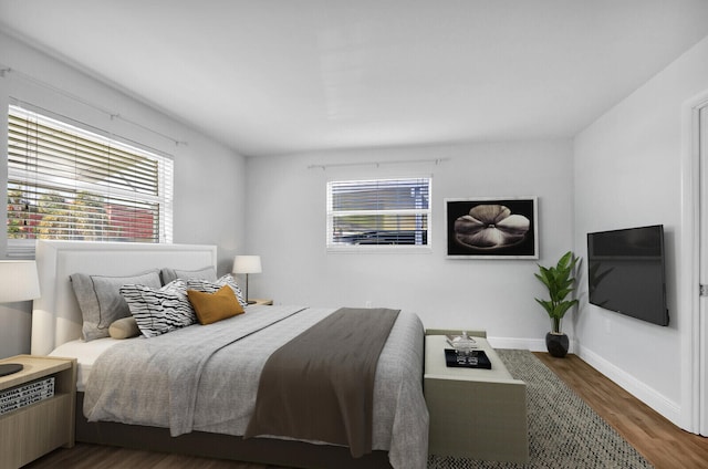 bedroom featuring dark wood-type flooring