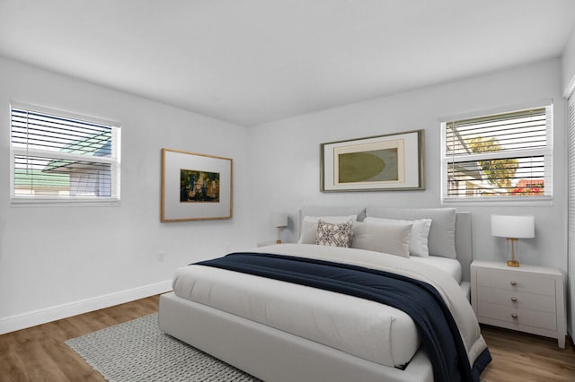 bedroom with wood-type flooring