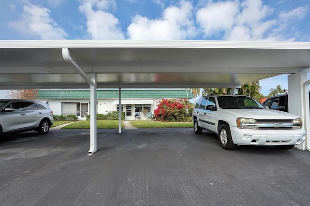 view of vehicle parking featuring a carport