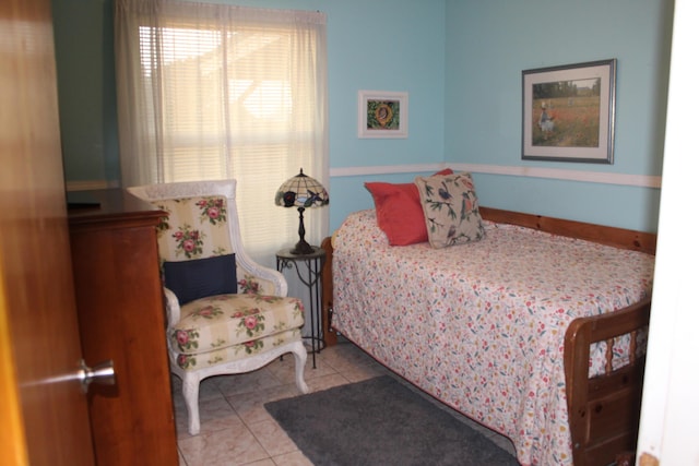 bedroom featuring light tile patterned flooring