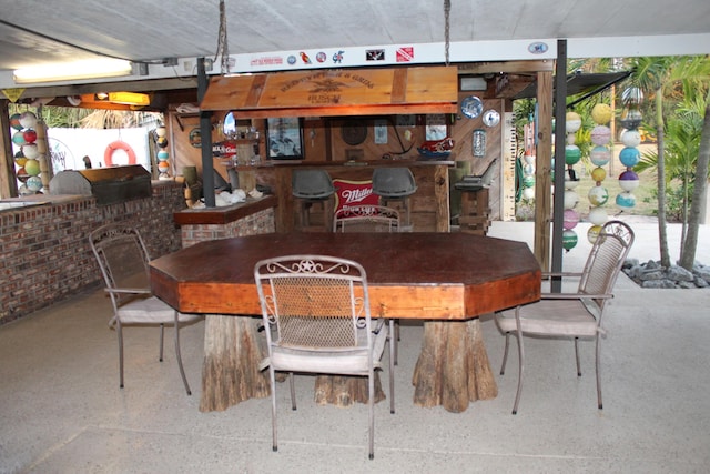 dining area with brick wall