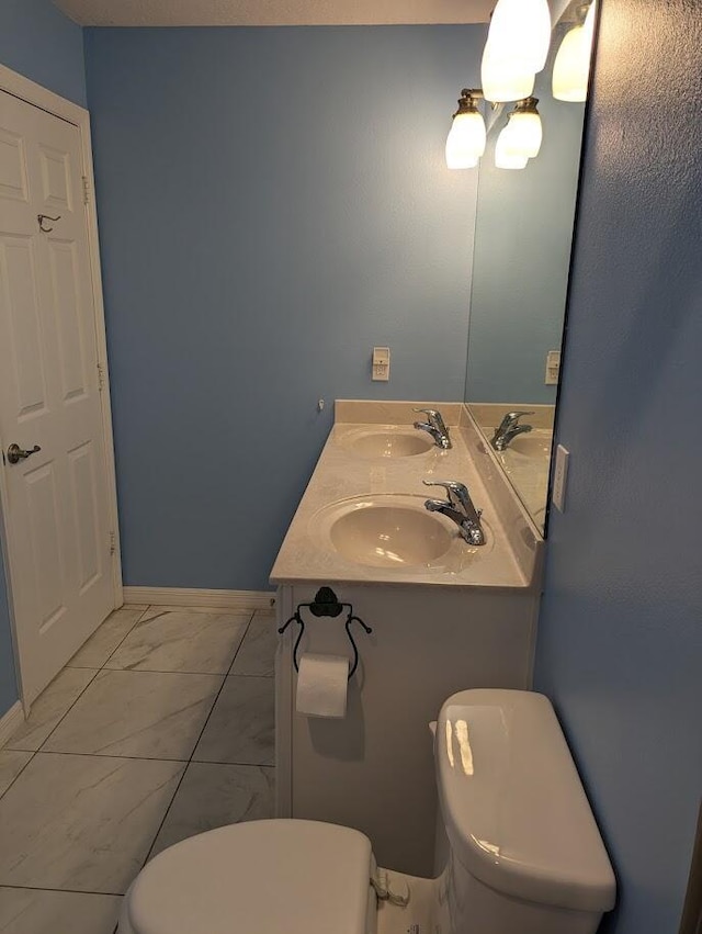 bathroom featuring toilet and sink