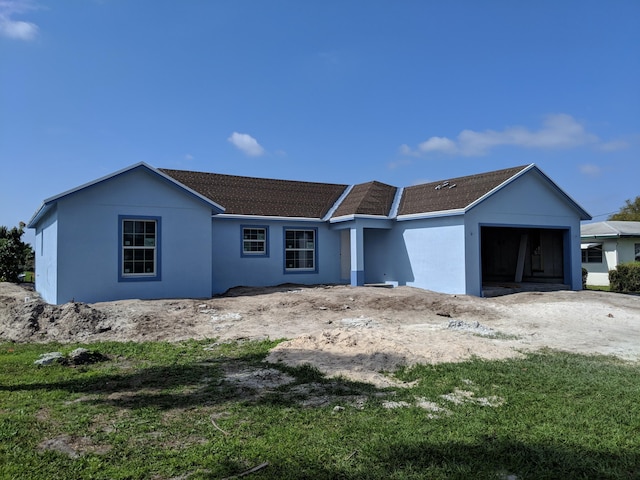 ranch-style house featuring a garage