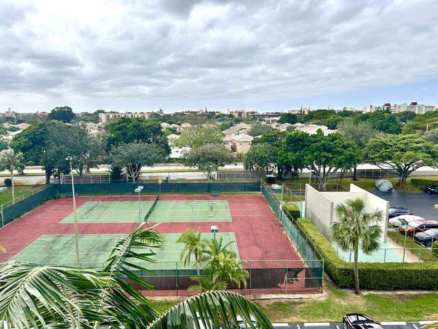 view of tennis court with fence