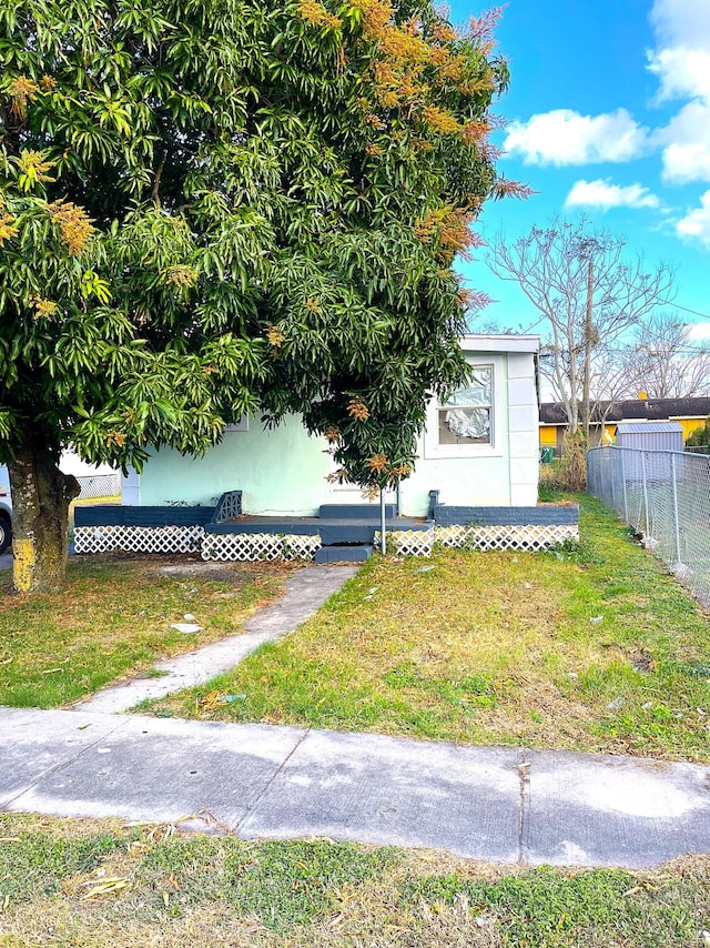 exterior space with a front lawn