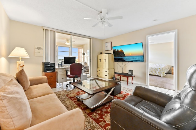 living room featuring ceiling fan and light tile patterned floors