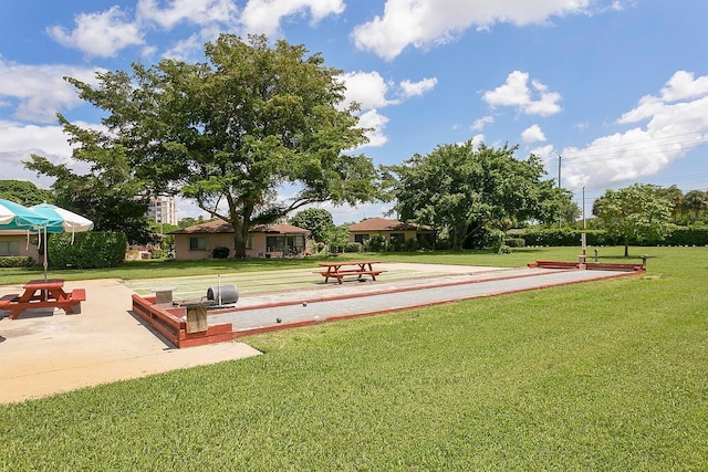 view of community with a lawn