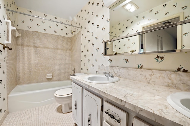 full bathroom featuring tile patterned floors, vanity, tiled shower / bath combo, and toilet