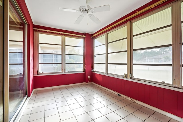 unfurnished sunroom featuring plenty of natural light and ceiling fan