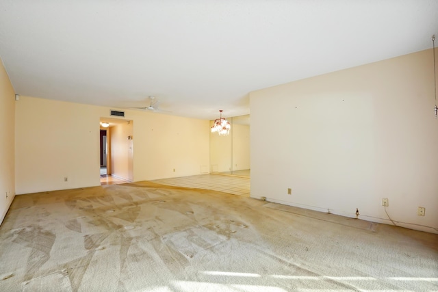 spare room with carpet and ceiling fan