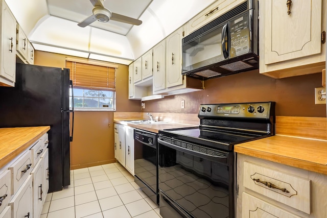 kitchen with black appliances, ceiling fan, light tile patterned flooring, and sink