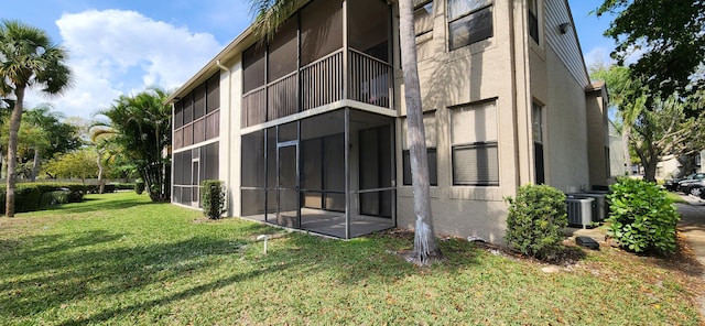 view of building exterior featuring central AC