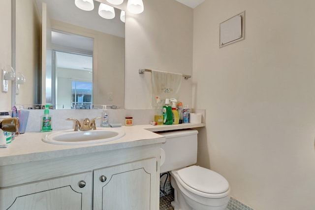 bathroom with vanity and toilet