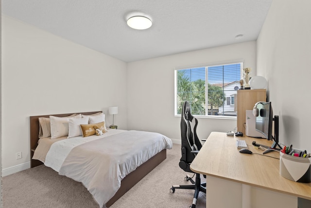 carpeted bedroom with a textured ceiling