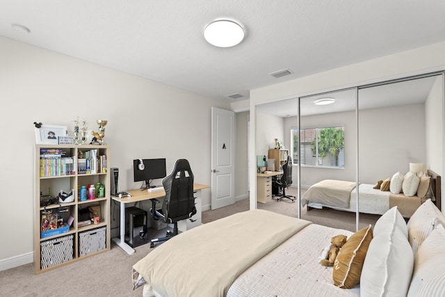 bedroom featuring a closet and carpet floors