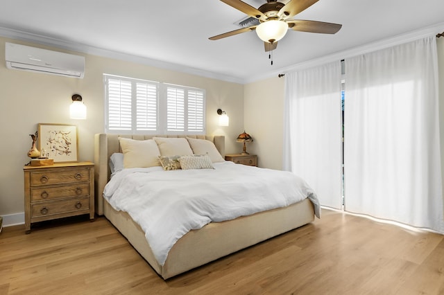 bedroom featuring crown molding, ceiling fan, light hardwood / wood-style floors, and a wall unit AC