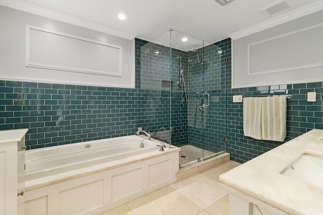 bathroom with crown molding, plus walk in shower, and tile walls