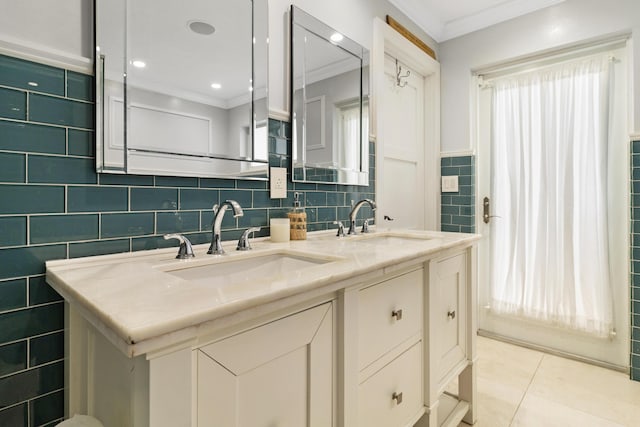 bathroom with tile patterned flooring, crown molding, tile walls, and vanity