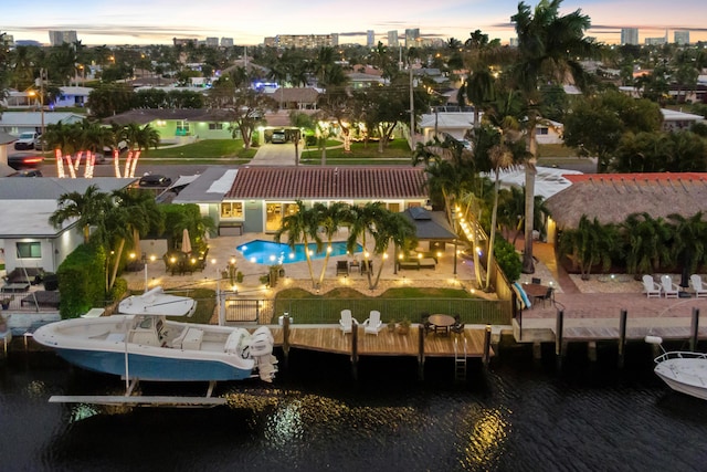 aerial view at dusk with a water view