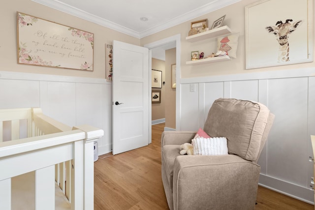 bedroom featuring hardwood / wood-style flooring and ornamental molding