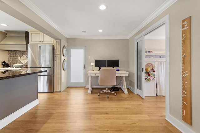 office space featuring crown molding and light hardwood / wood-style floors