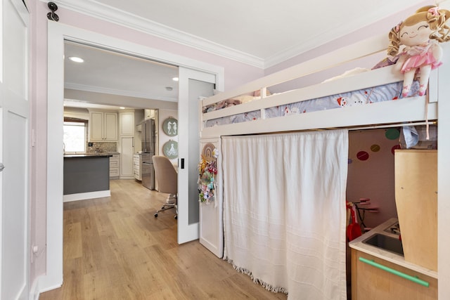 interior space with crown molding and light wood-type flooring