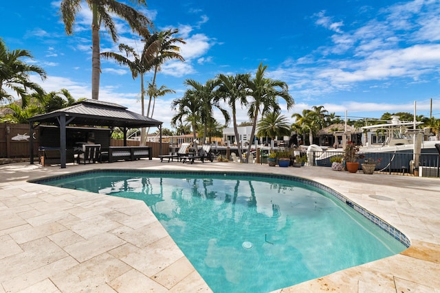 view of swimming pool featuring a gazebo and a patio area