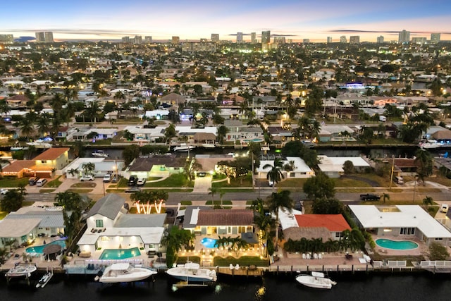 aerial view at dusk with a water view